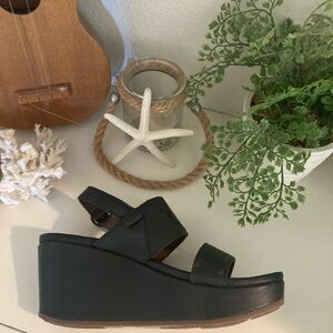 Olukai size 7 black leather  wedge shoes. Brand new never worn.